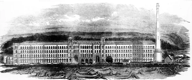 Wood engraving of the long south front of Salts Mill with its tall chimney, hills behind and stooks of corn in the field in front.